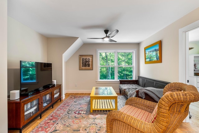 living room featuring hardwood / wood-style flooring and ceiling fan