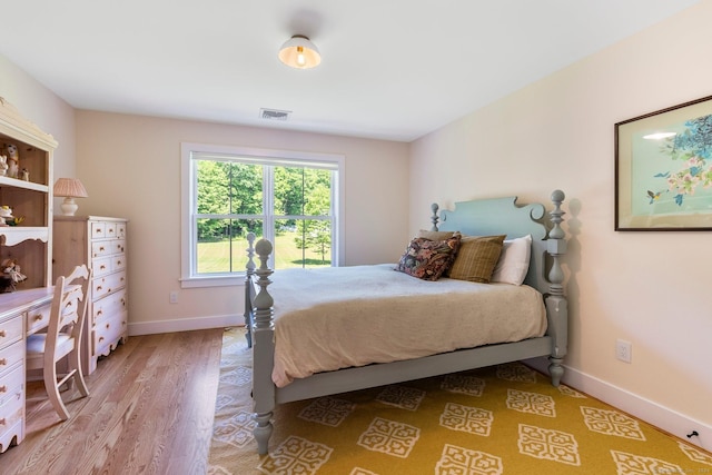 bedroom with wood-type flooring