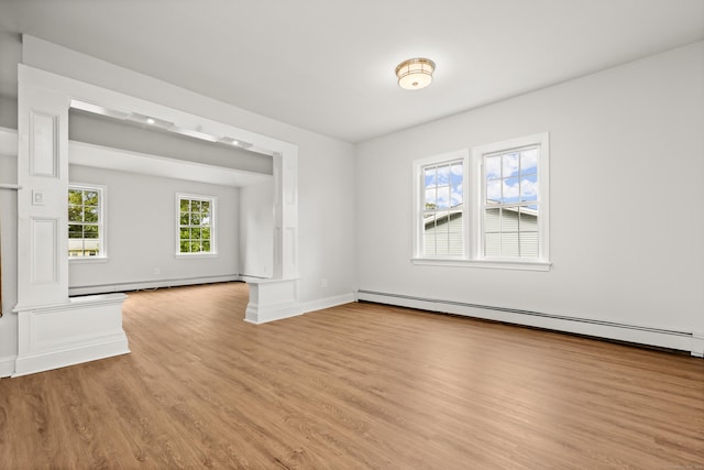 interior space featuring light hardwood / wood-style floors and baseboard heating