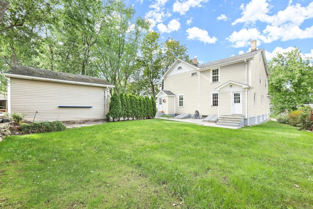 back of house featuring a yard