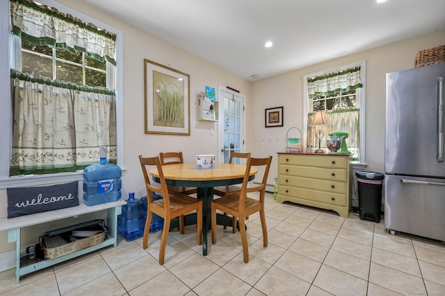 dining space with light tile patterned floors