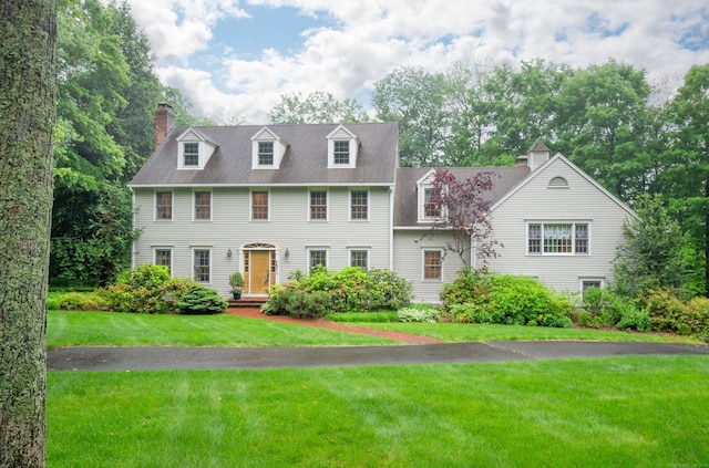 18 Hunters Ridge Rd, Southbury, CT 06488 - colonial inspired home with a chimney, a front yard, and a shingled roof