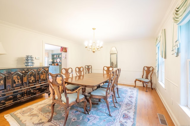 18 Hunters Ridge Rd, Southbury, CT 06488 - dining room with a chandelier, light wood finished floors, and crown molding