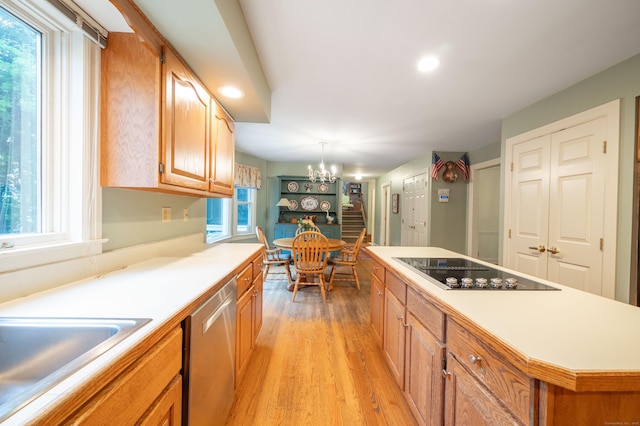 18 Hunters Ridge Rd, Southbury, CT 06488 - kitchen featuring stainless steel dishwasher, black electric stovetop, light wood-type flooring, a chandelier, and light countertops