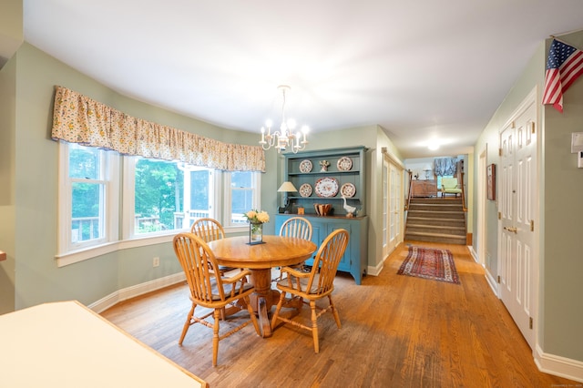 18 Hunters Ridge Rd, Southbury, CT 06488 - dining room with a chandelier, wood finished floors, stairs, and baseboards