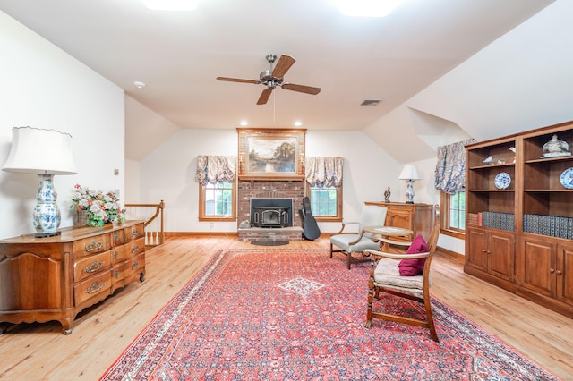 18 Hunters Ridge Rd, Southbury, CT 06488 - living room featuring ceiling fan, light wood-style flooring, vaulted ceiling, a wood stove, and baseboards