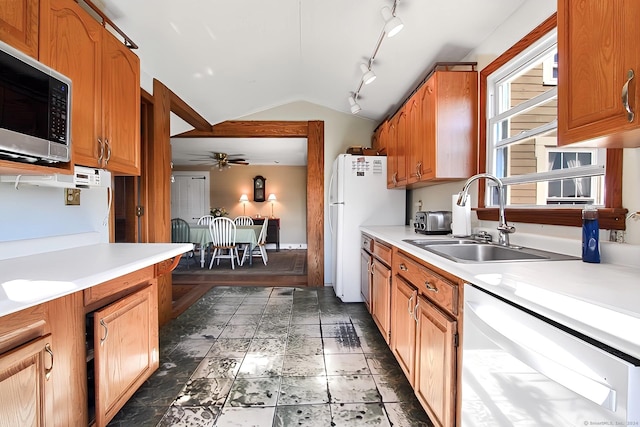 kitchen featuring stainless steel appliances, ceiling fan, lofted ceiling, and sink