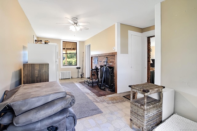 living room with radiator and ceiling fan