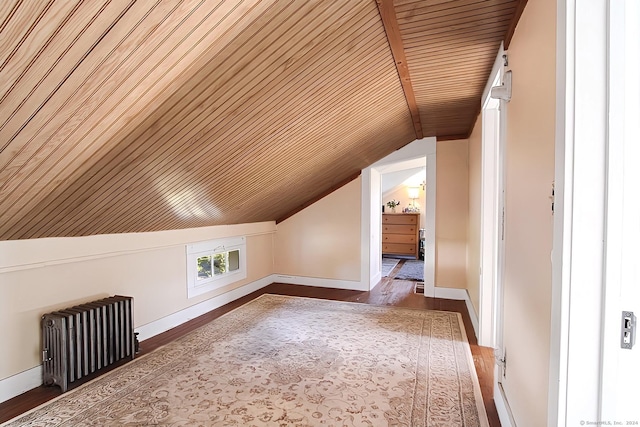 additional living space featuring radiator, hardwood / wood-style floors, wood ceiling, and vaulted ceiling