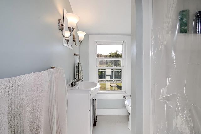 bathroom featuring vanity and toilet