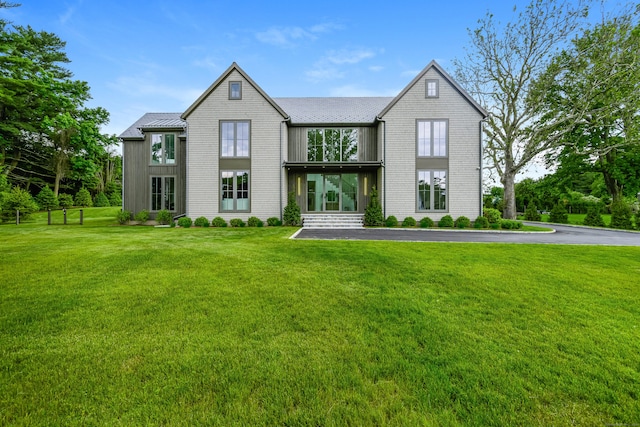 view of front of home with a front yard