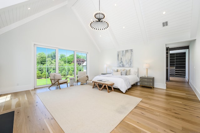 bedroom featuring access to exterior, beamed ceiling, high vaulted ceiling, and light wood-type flooring