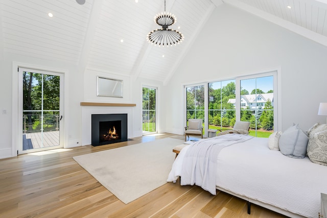 bedroom with access to outside, wooden ceiling, high vaulted ceiling, and light hardwood / wood-style floors