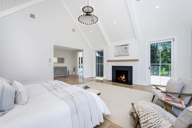 bedroom featuring access to outside, baseboard heating, high vaulted ceiling, beamed ceiling, and light hardwood / wood-style floors