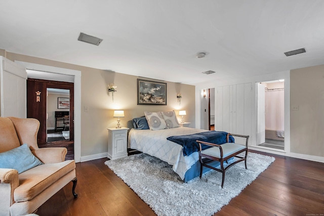 bedroom with dark wood-type flooring