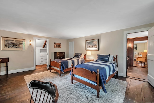 bedroom with dark hardwood / wood-style floors