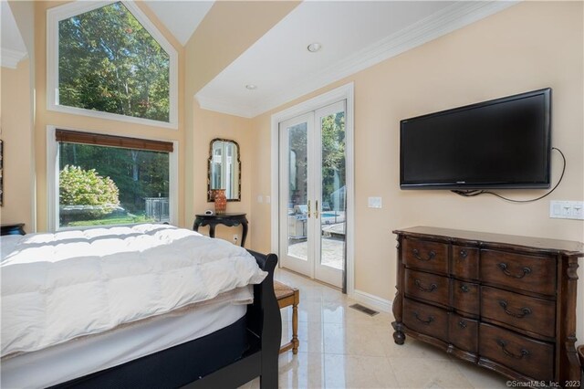 tiled bedroom featuring crown molding, lofted ceiling, french doors, and access to outside