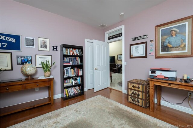 office space with dark hardwood / wood-style flooring