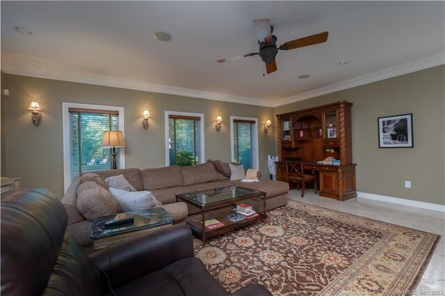 tiled living room featuring ceiling fan and ornamental molding