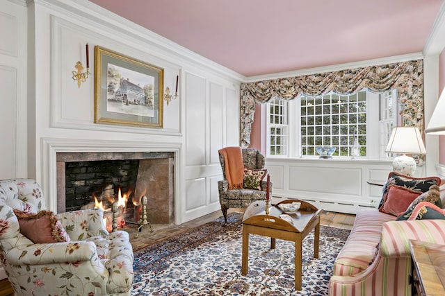 interior space with ornamental molding, a fireplace, wood-type flooring, and a baseboard heating unit