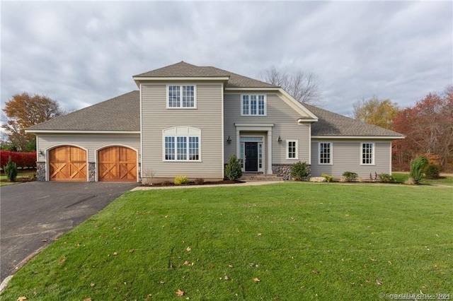 22 Somerset Dr, Middlebury, CT 06762 - traditional home featuring driveway, an attached garage, a front lawn, and roof with shingles