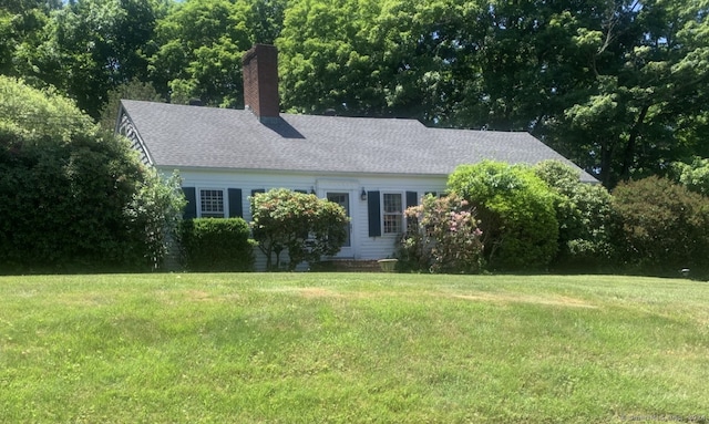 view of side of property with a yard