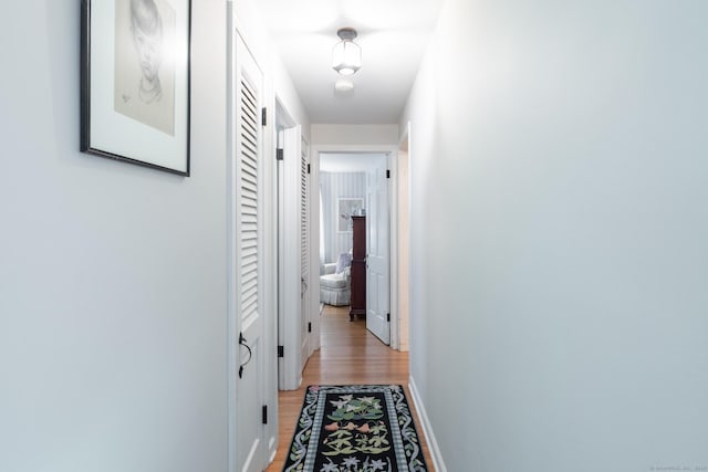 hall with light hardwood / wood-style flooring