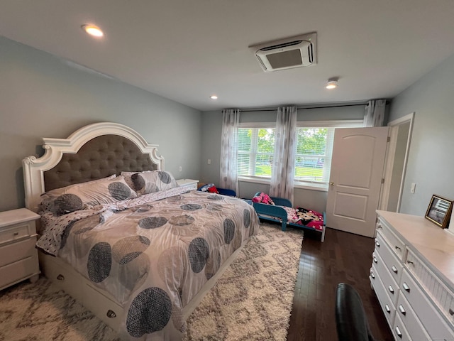 bedroom featuring dark hardwood / wood-style flooring