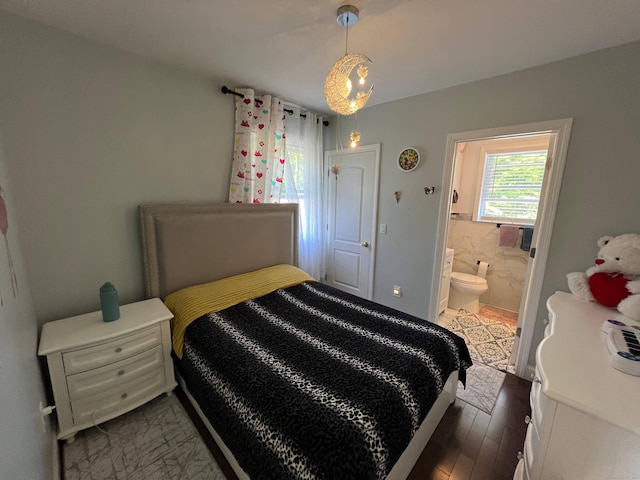 bedroom with dark hardwood / wood-style flooring