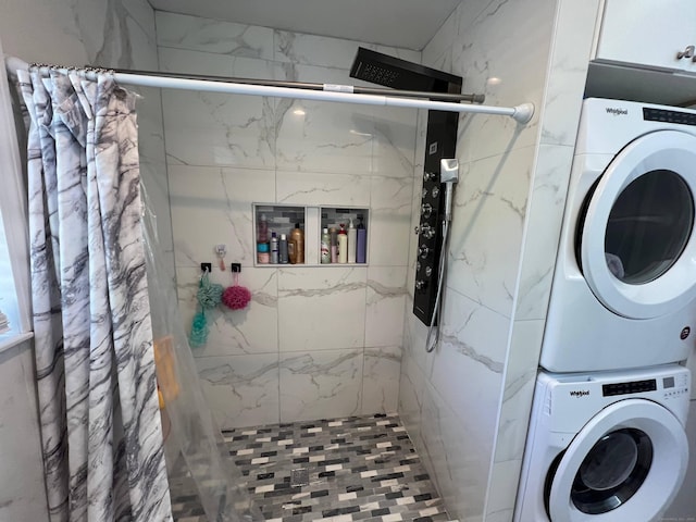 laundry room with stacked washing maching and dryer