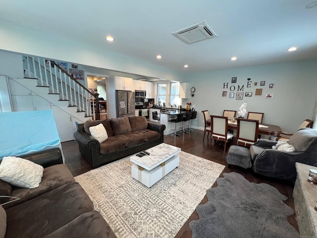 living room with dark hardwood / wood-style floors