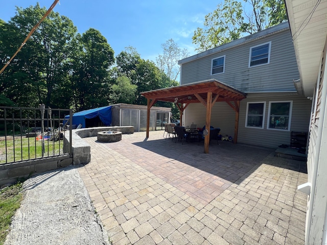 view of patio / terrace featuring a pergola and a fire pit