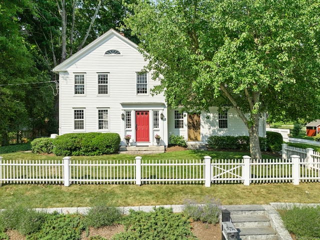 view of front of home with a front lawn