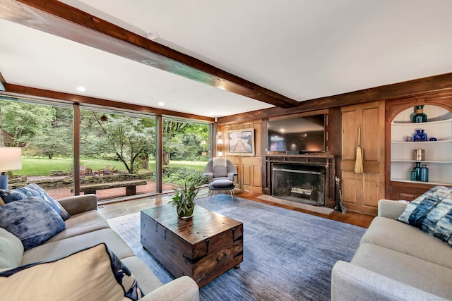 living room with hardwood / wood-style flooring and beamed ceiling