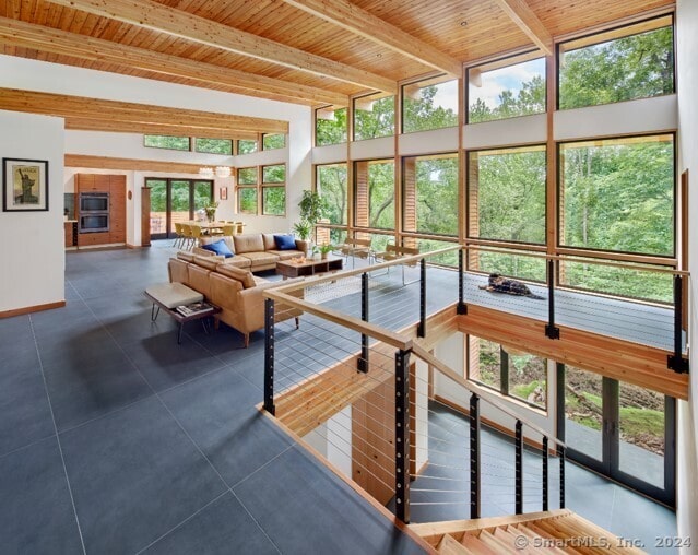 sunroom / solarium with beamed ceiling and wood ceiling