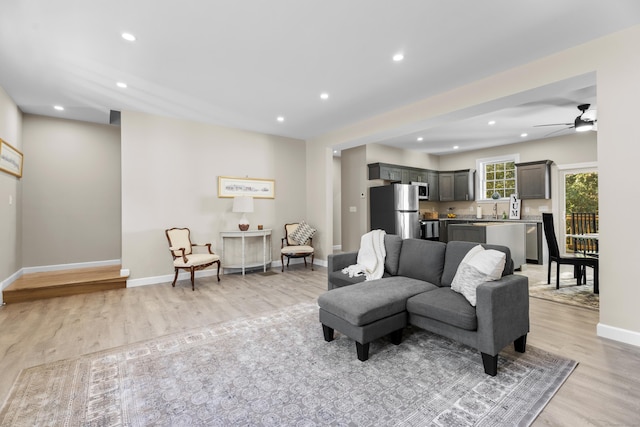 203 Winding Hollow Rd, Groton, CT 06340 - living room with light wood-style flooring, baseboards, a ceiling fan, and recessed lighting