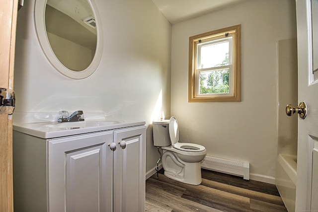 bathroom featuring hardwood / wood-style floors, vanity, a baseboard radiator, and toilet