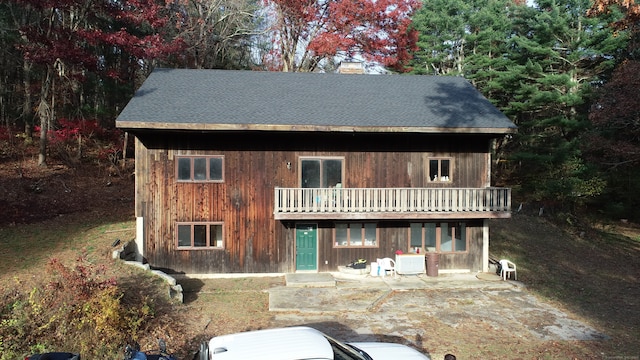 exterior space with a patio and a balcony