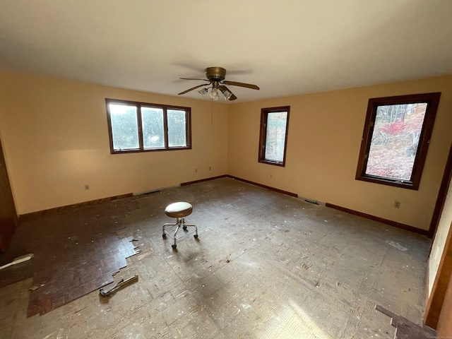 empty room featuring ceiling fan