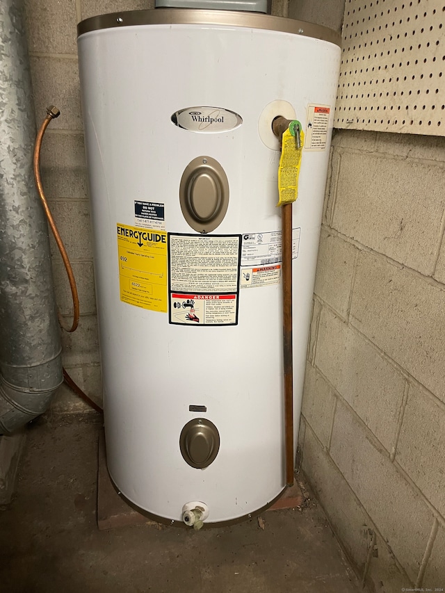 utility room with electric water heater