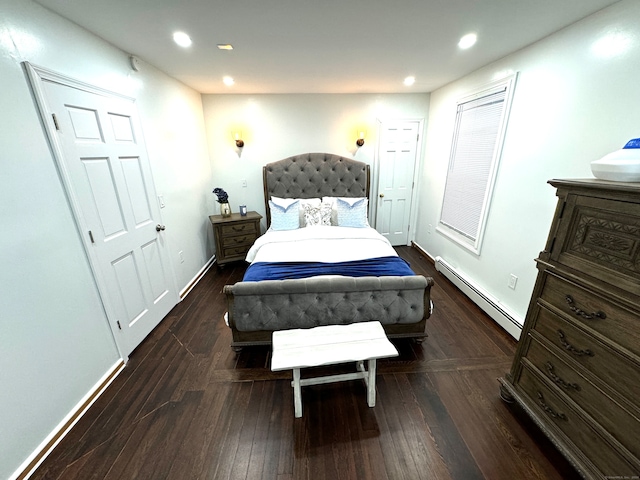 bedroom featuring dark hardwood / wood-style floors and baseboard heating