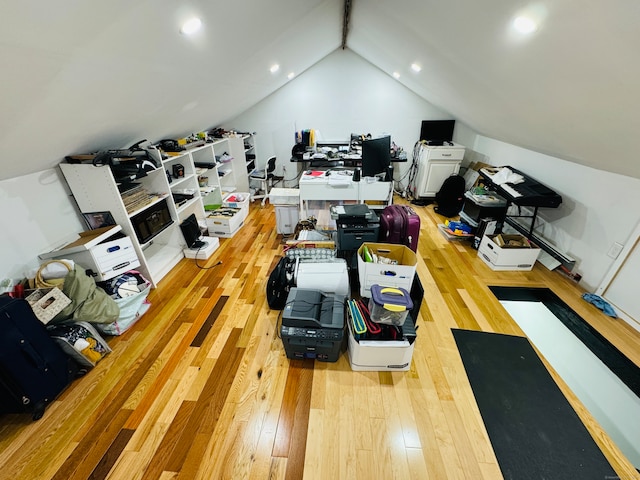 home office featuring vaulted ceiling and light wood-type flooring