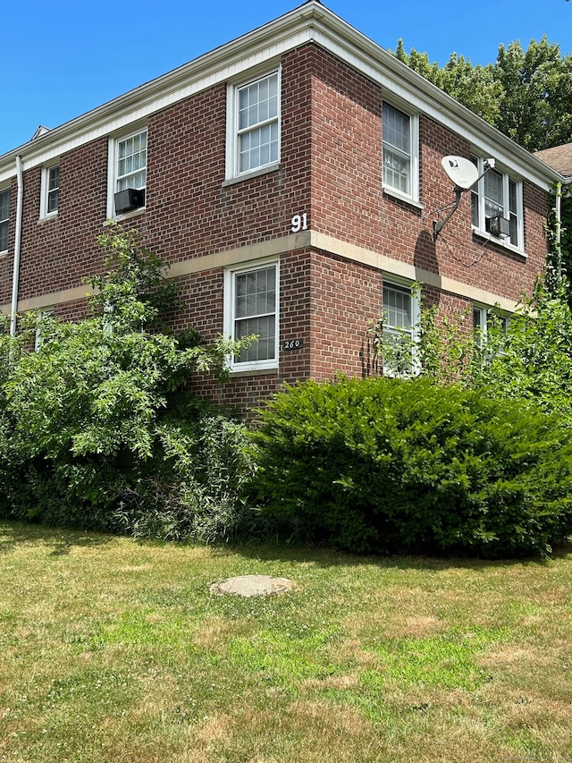 view of property exterior featuring a yard