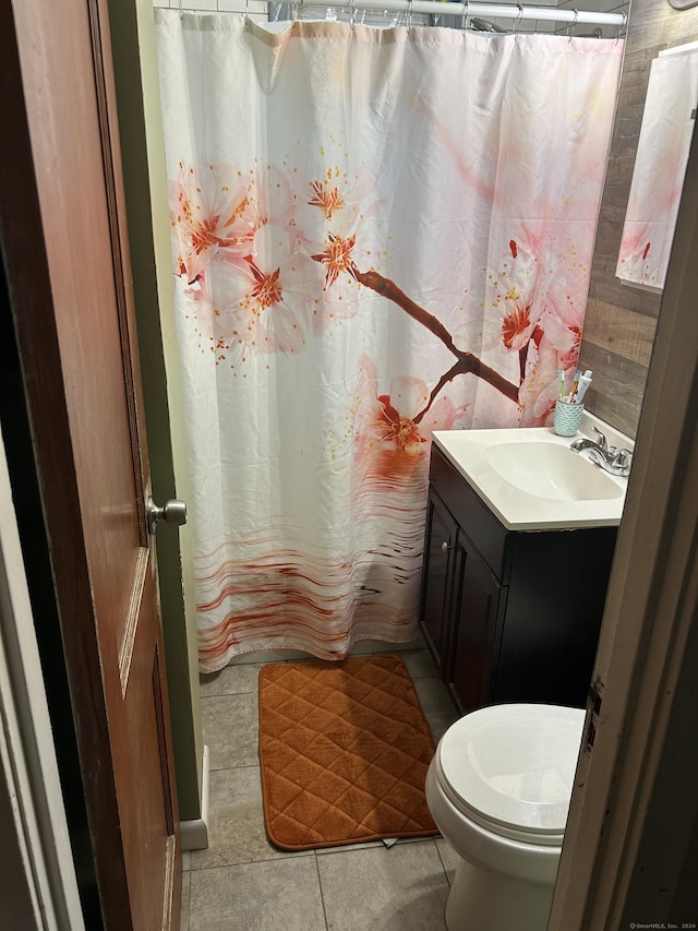 260 Success Ave Unit 21, Bridgeport, CT 06610 - bathroom featuring tile patterned floors, vanity, toilet, and a shower with curtain