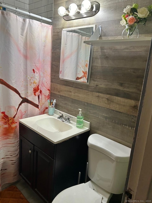 260 Success Ave Unit 21, Bridgeport, CT 06610 - full bath with toilet, vanity, wooden walls, and curtained shower