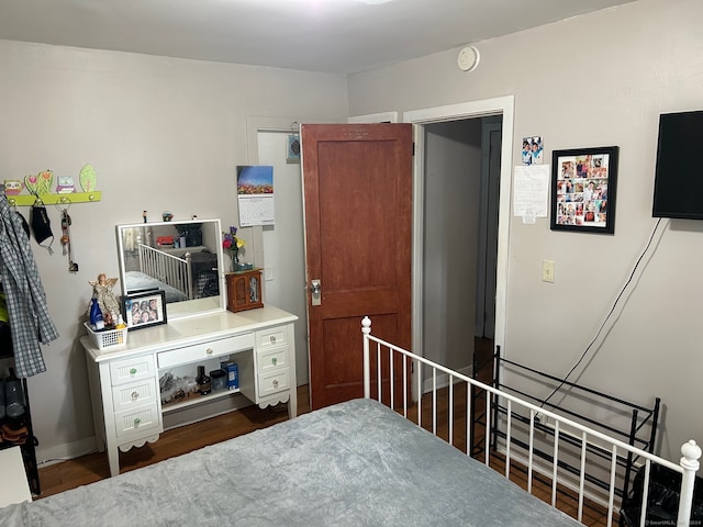 bedroom featuring dark hardwood / wood-style flooring