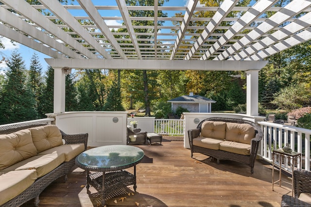 wooden deck featuring a pergola and an outdoor hangout area