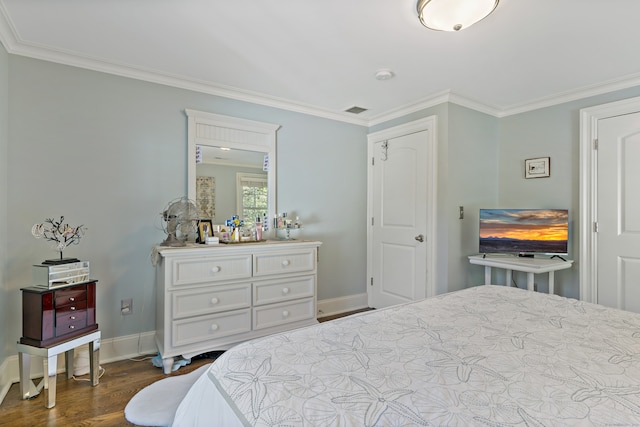 bedroom featuring dark wood-type flooring and crown molding