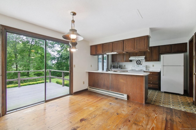 kitchen with decorative light fixtures, light wood-type flooring, a baseboard radiator, kitchen peninsula, and white appliances