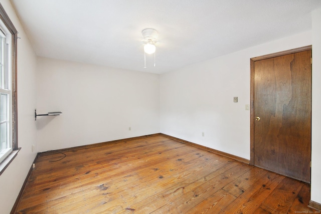 spare room featuring wood-type flooring